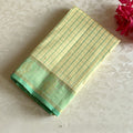 Classy Butter Cream Checkered Kanjeevaram Silk Saree With Mint Green