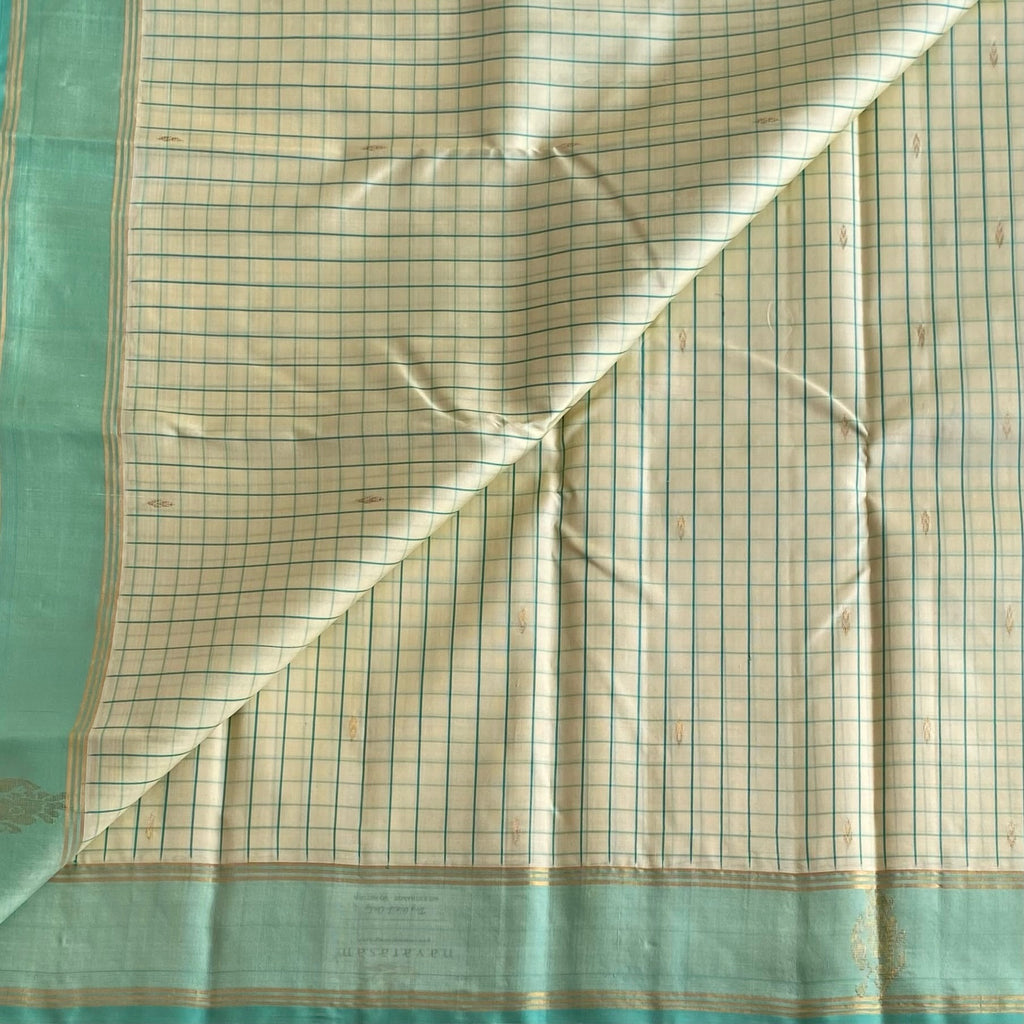 Classy Butter Cream Checkered Kanjeevaram Silk Saree With Mint Green