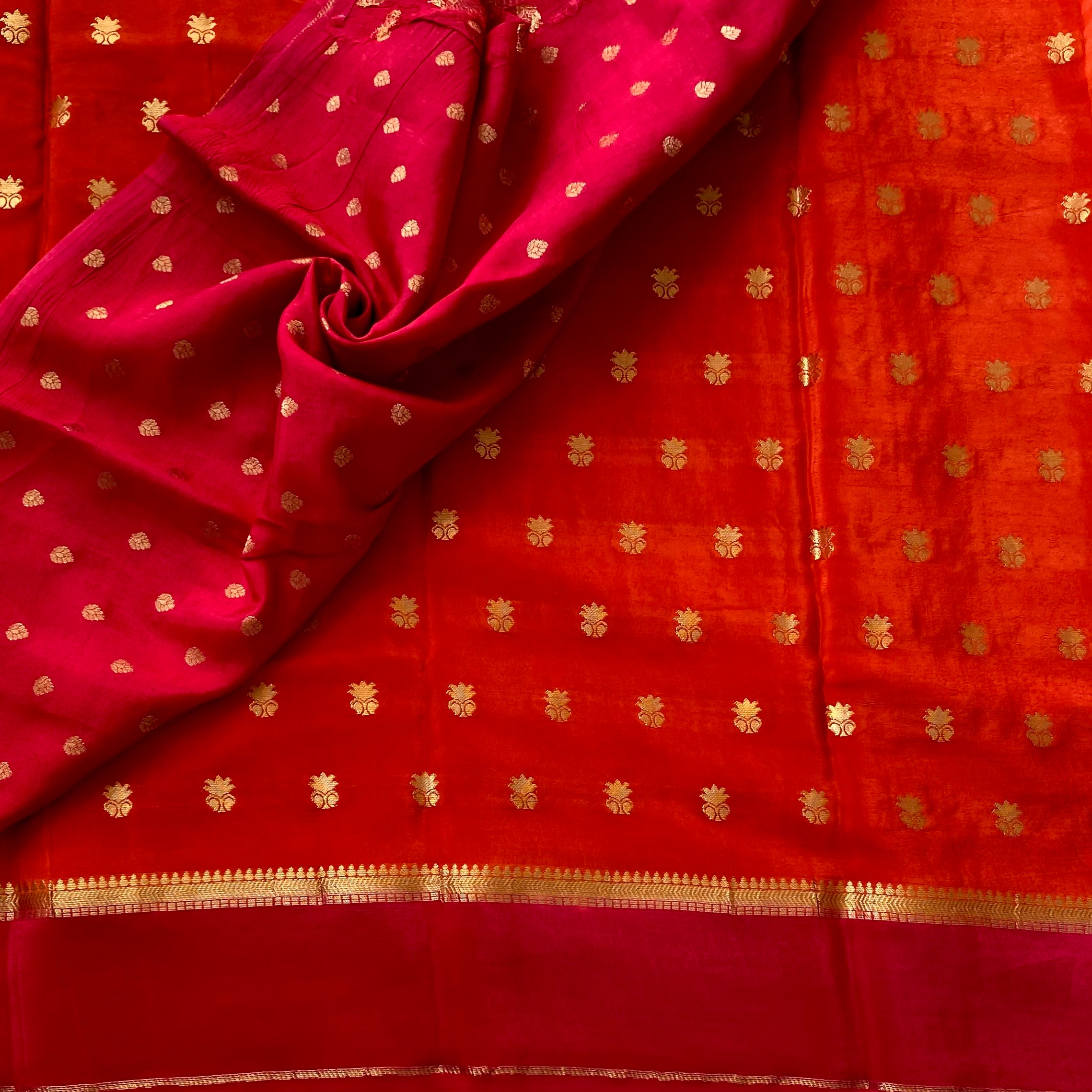 Sunset orange with rani pink soft crepe silk with zari buttas