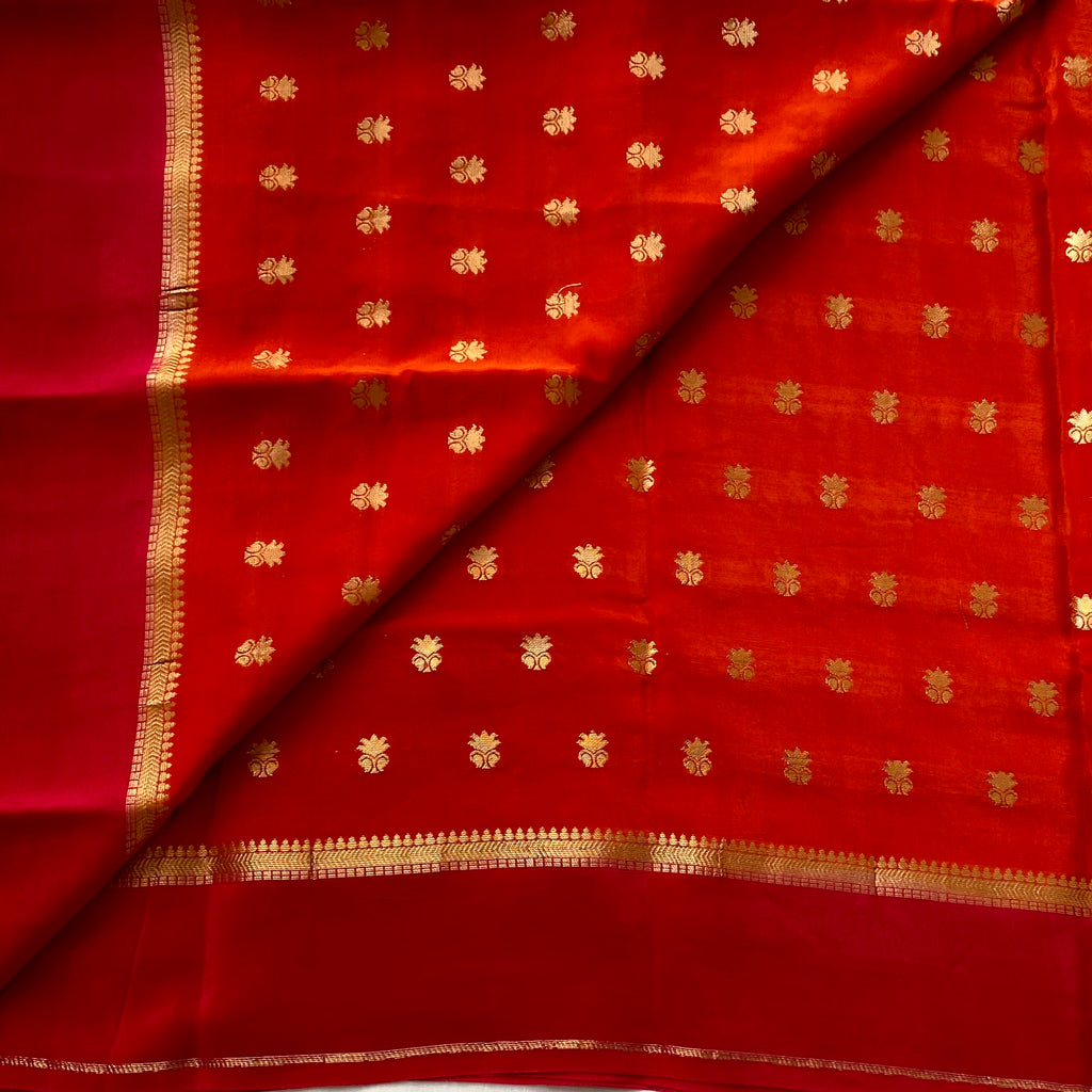Sunset orange with rani pink soft crepe silk with zari buttas