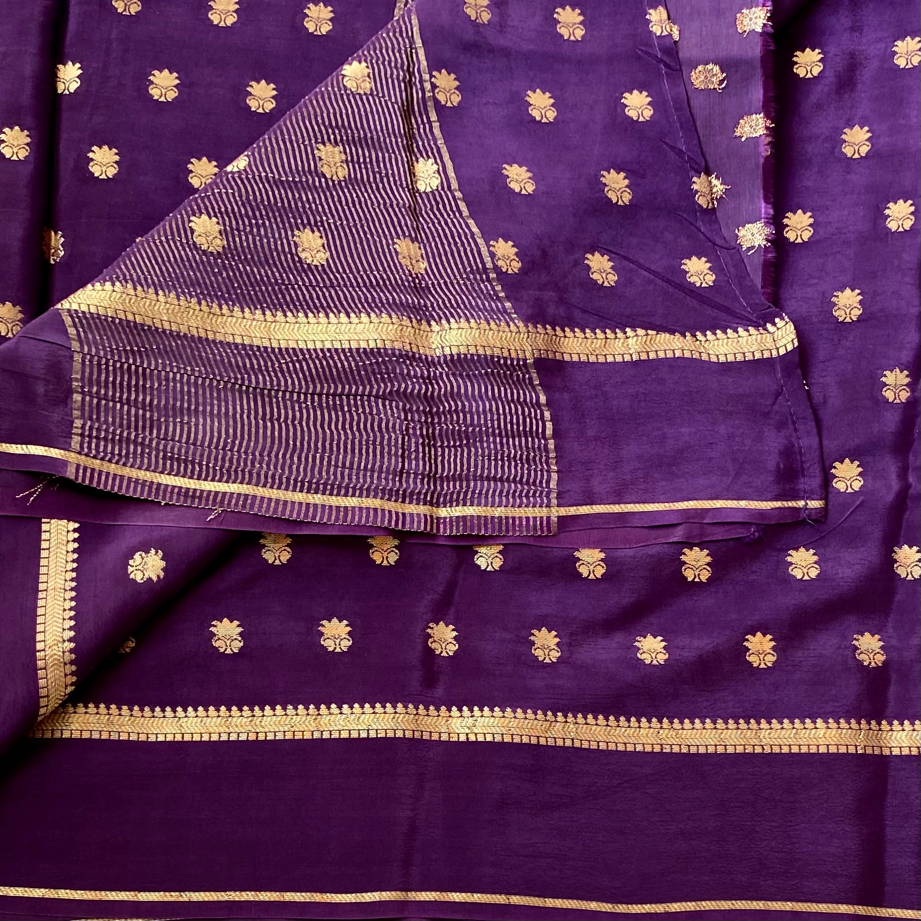 Brinjal Purple soft crepe stunner with gold zari woven buttas