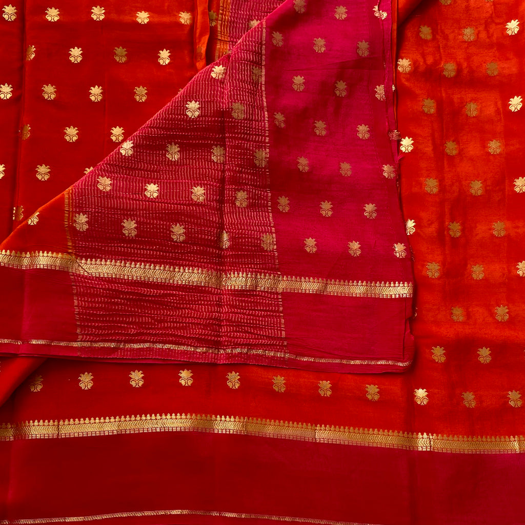 Sunset orange with rani pink soft crepe silk with zari buttas