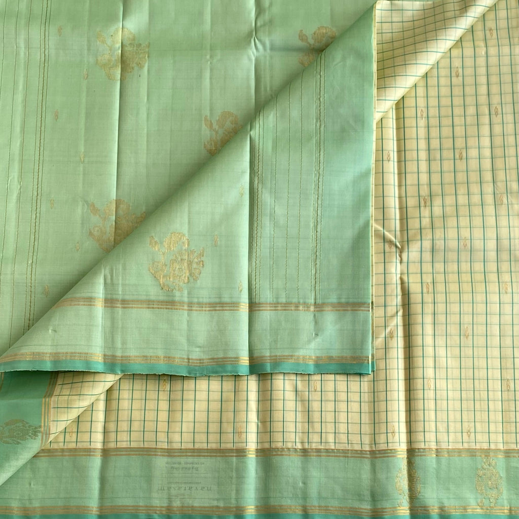 Classy Butter Cream Checkered Kanjeevaram Silk Saree With Mint Green