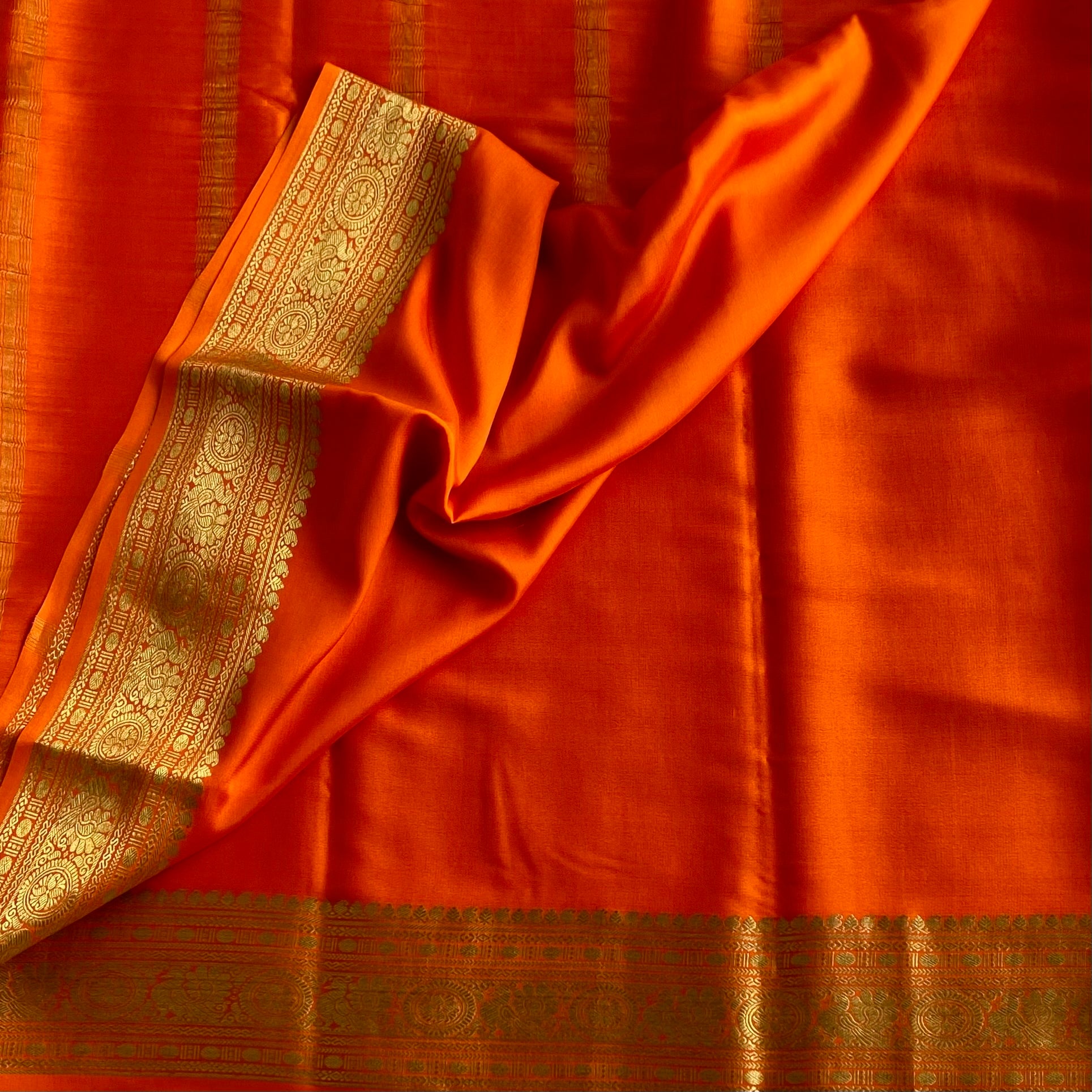Sunset Orange Mysore Crepe Silk Saree With Metallic Gold Border