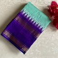 Micro Checkered Sea Green Pure Ikkat Handloom Silk With Ikkat Woven Pallu & Blouse