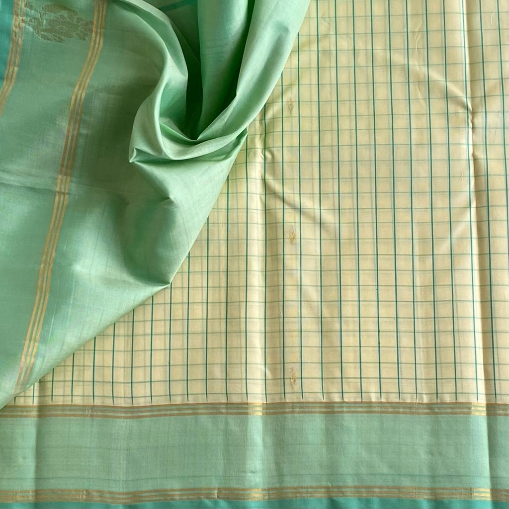 Classy Butter Cream Checkered Kanjeevaram Silk Saree With Mint Green