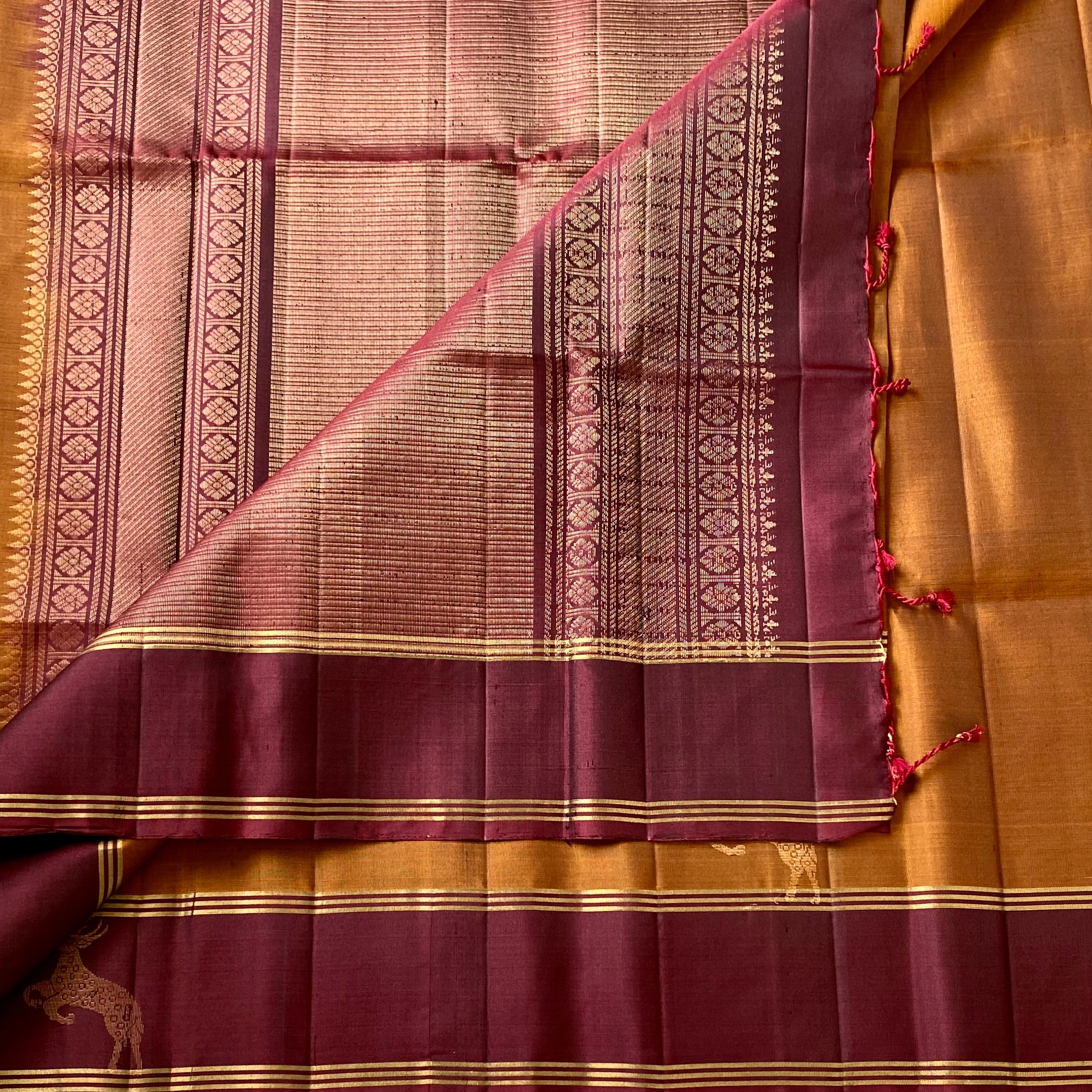 Magical rust with wine, maroon designer pure silk with dear motifs