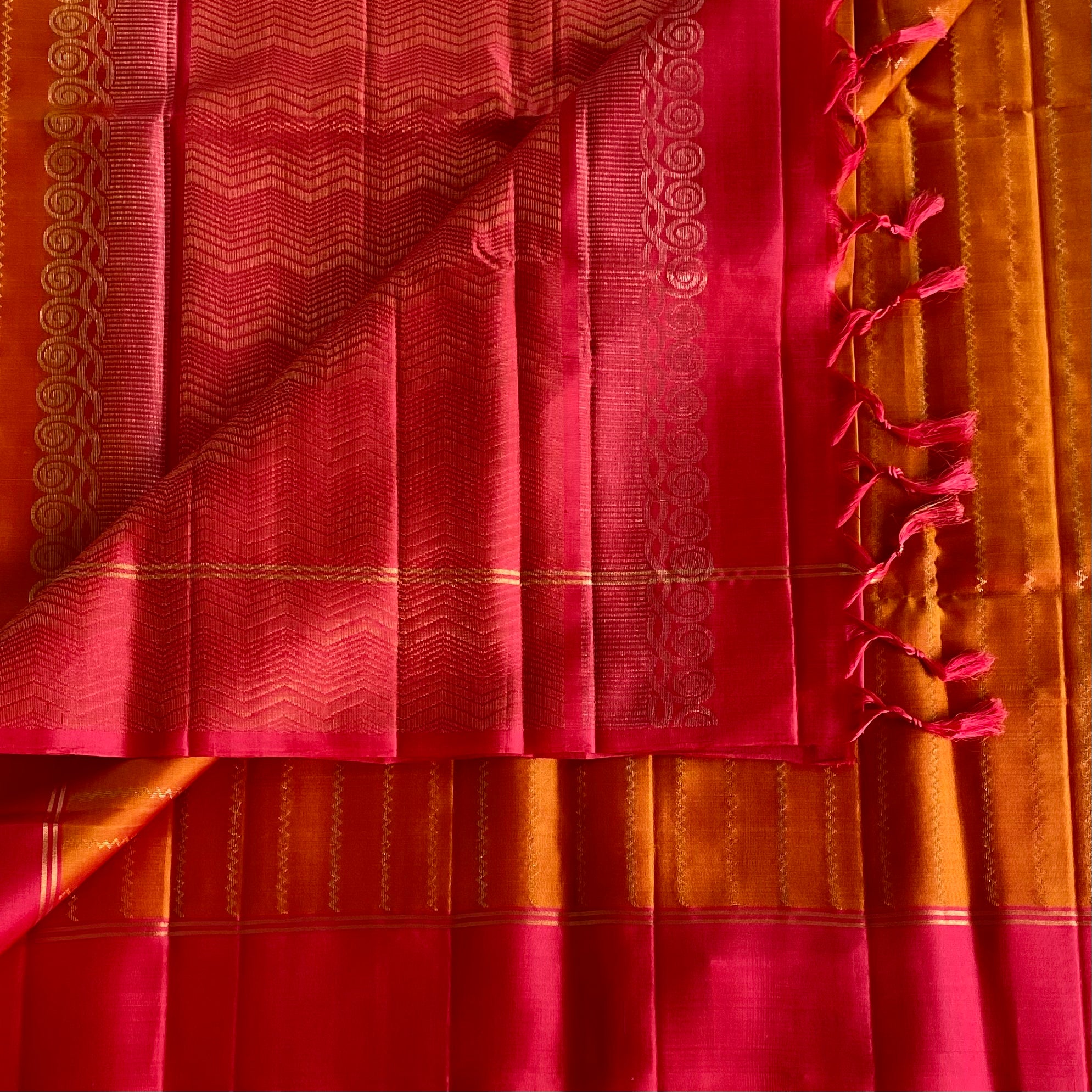 Saffron Orange Designer Pure Silk Saree With Rani Pink Pallu Gold Border
