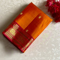 Saffron Orange Kanjeevaram Pure Zari Silk Saree With Rani Pink Pallu