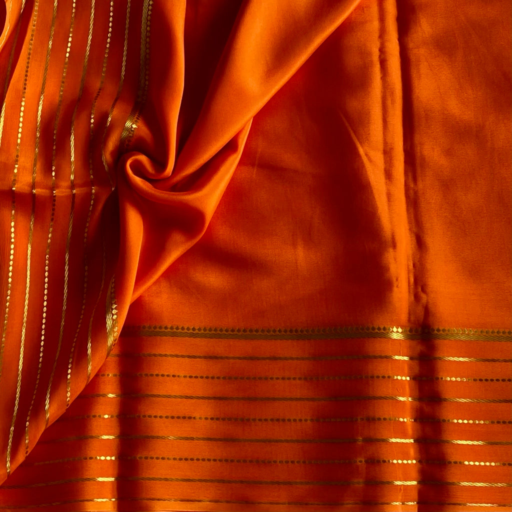 Sunset Orange Mysore Crepe Silk Saree With Metallic Gold Stripes