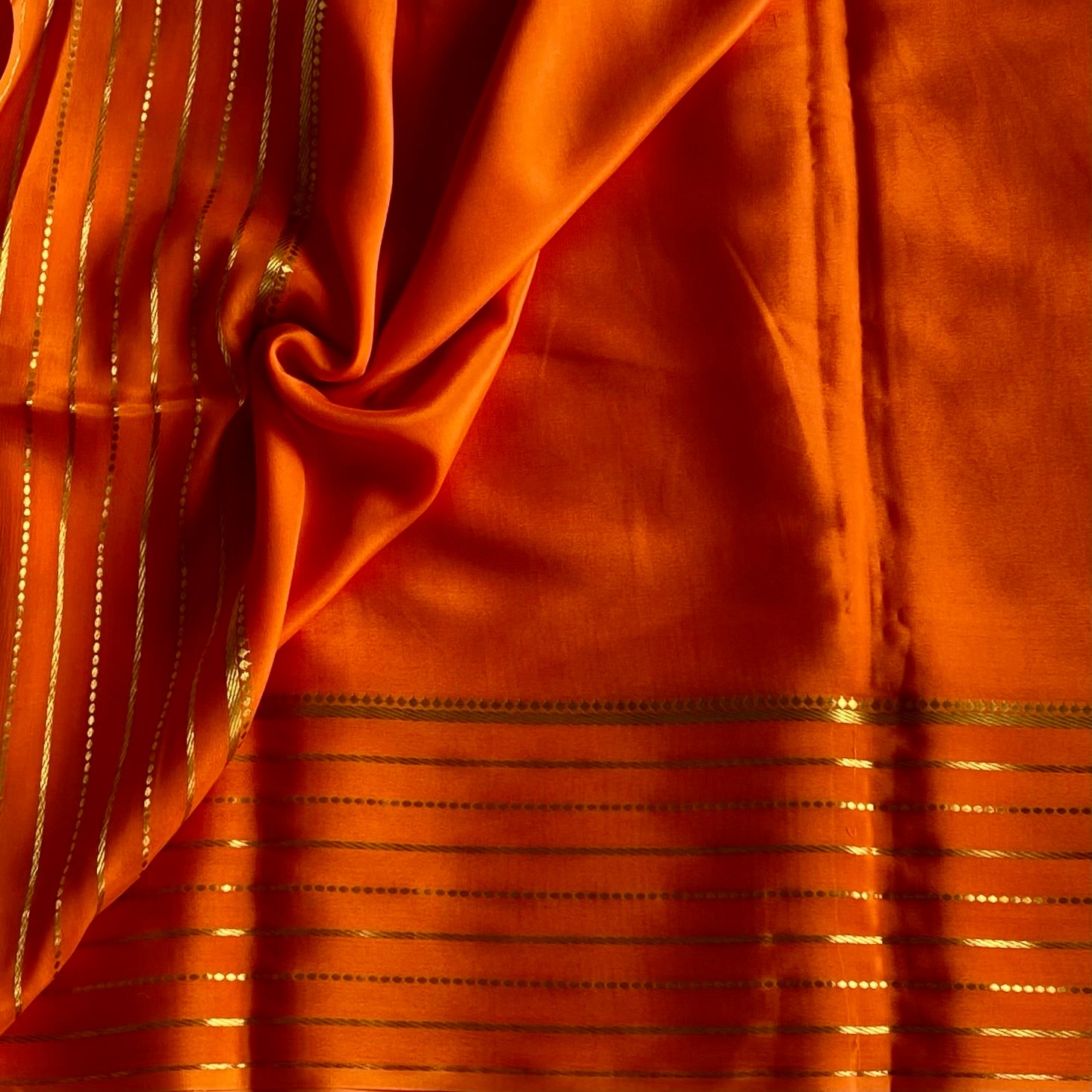 Sunset Orange Mysore Crepe Silk Saree With Metallic Gold Stripes