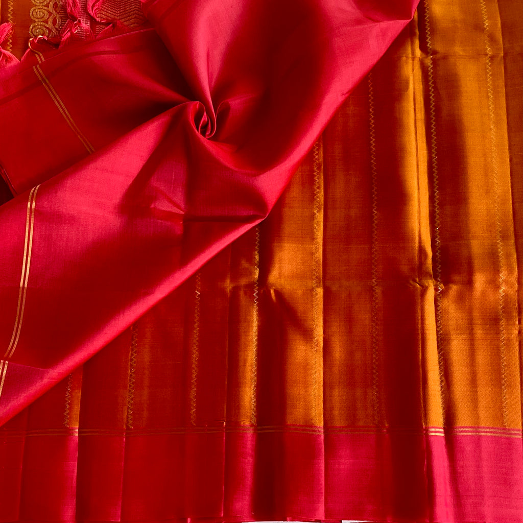 Saffron Orange Designer Pure Silk Saree With Rani Pink Pallu Gold Border