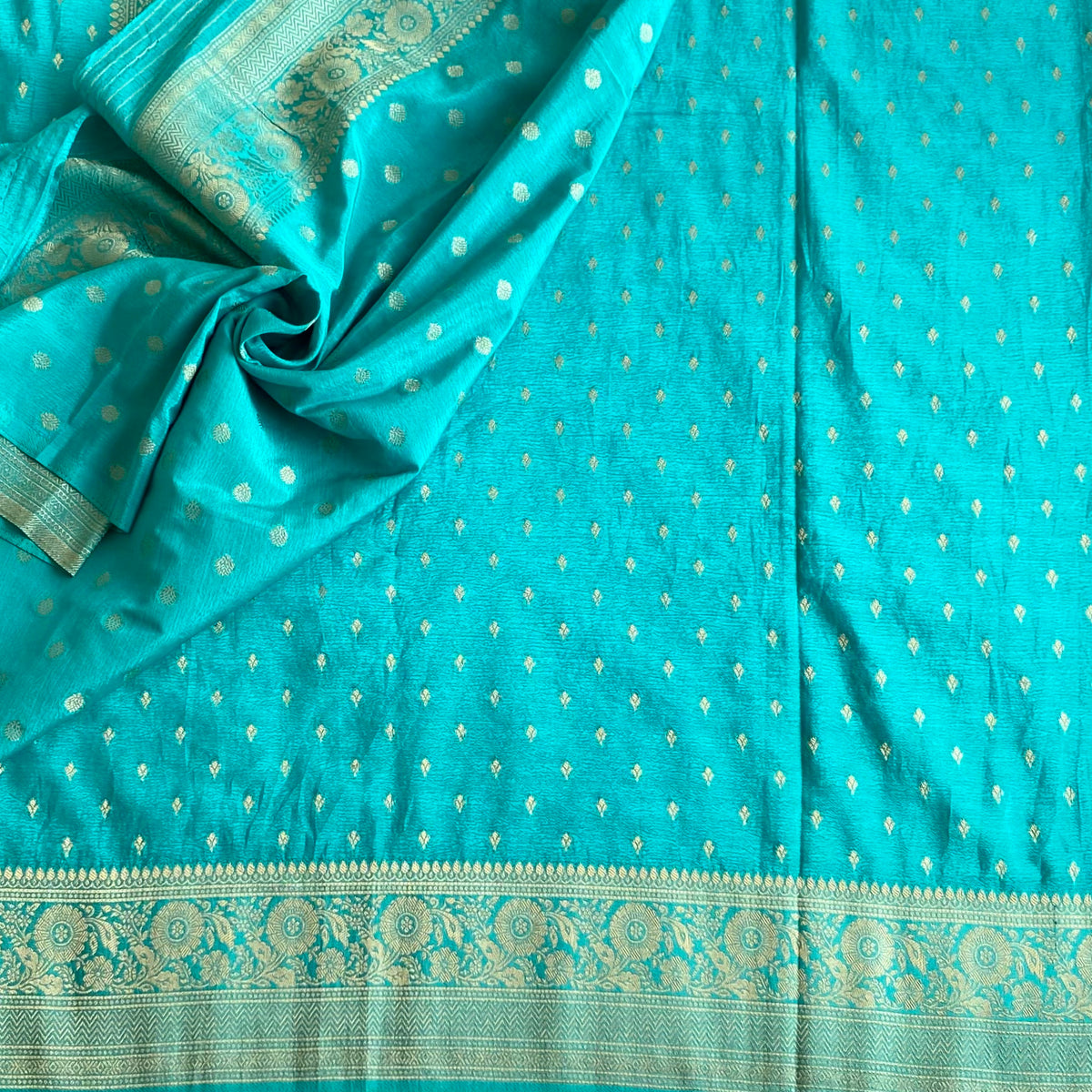 Turquoise Soft Crepe Silk Saree With Metallic Gold Brocade Border And Pallu