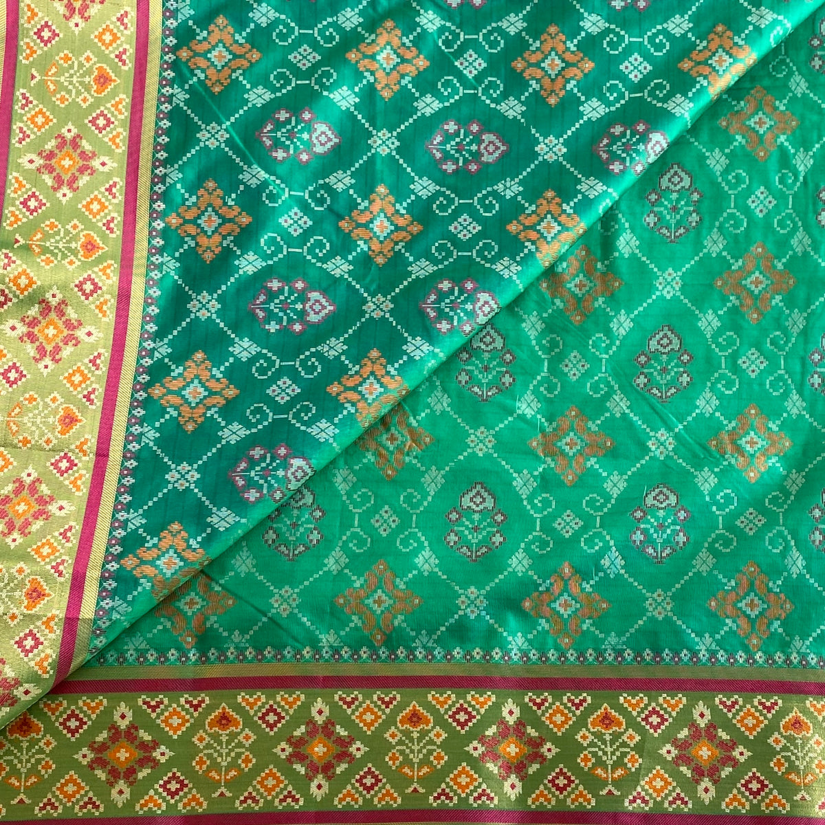 Jewel Green Patola Printed Soft Tussar Silk Saree With Raspberry Pink Pallu