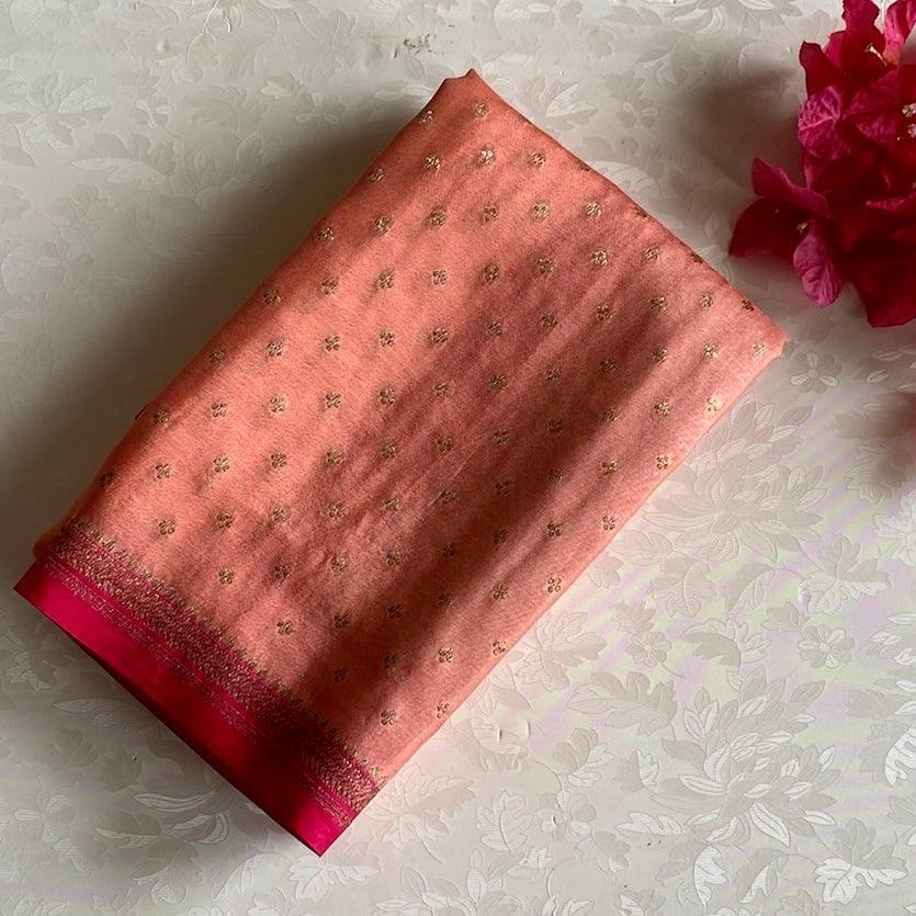 Blush Peach Banarasi Crepe Silk Saree With Rani Pink Pallu And Gold Zari