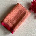 Blush Peach Banarasi Crepe Silk Saree With Rani Pink Pallu And Gold Zari