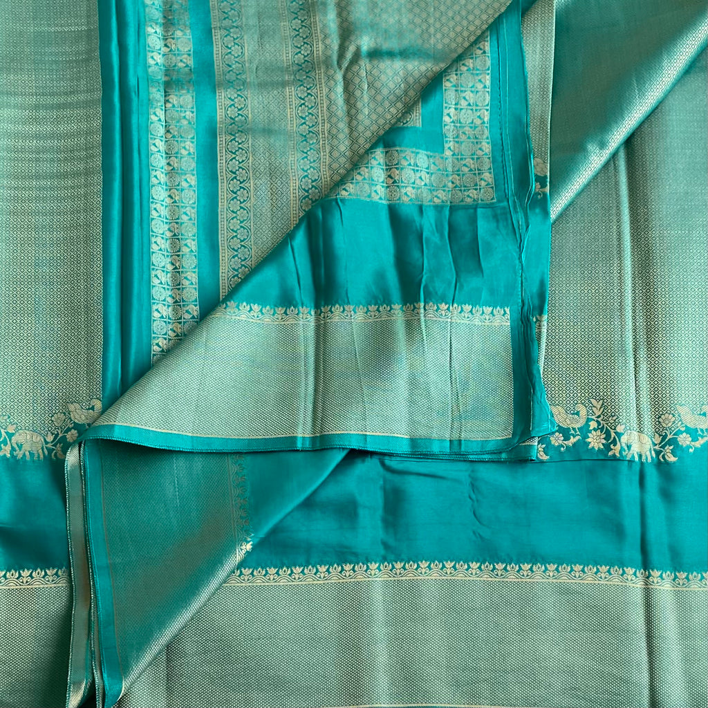 Teal Blue Soft Crepe Silk Saree With Navy Blue Border