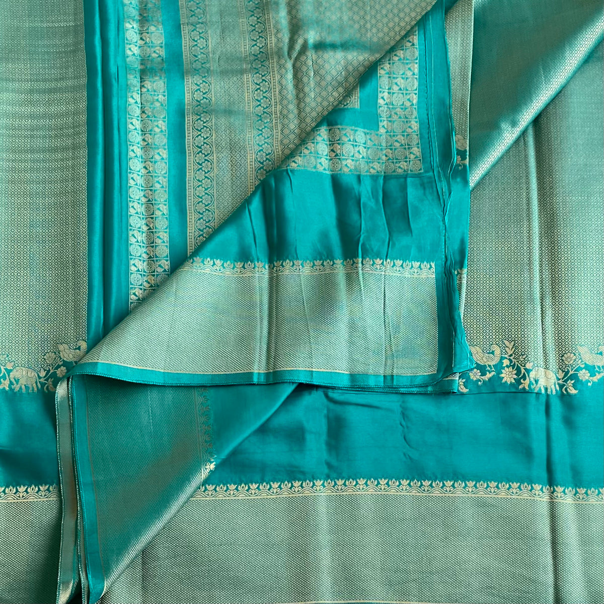 Teal Blue Soft Crepe Silk Saree With Navy Blue Border