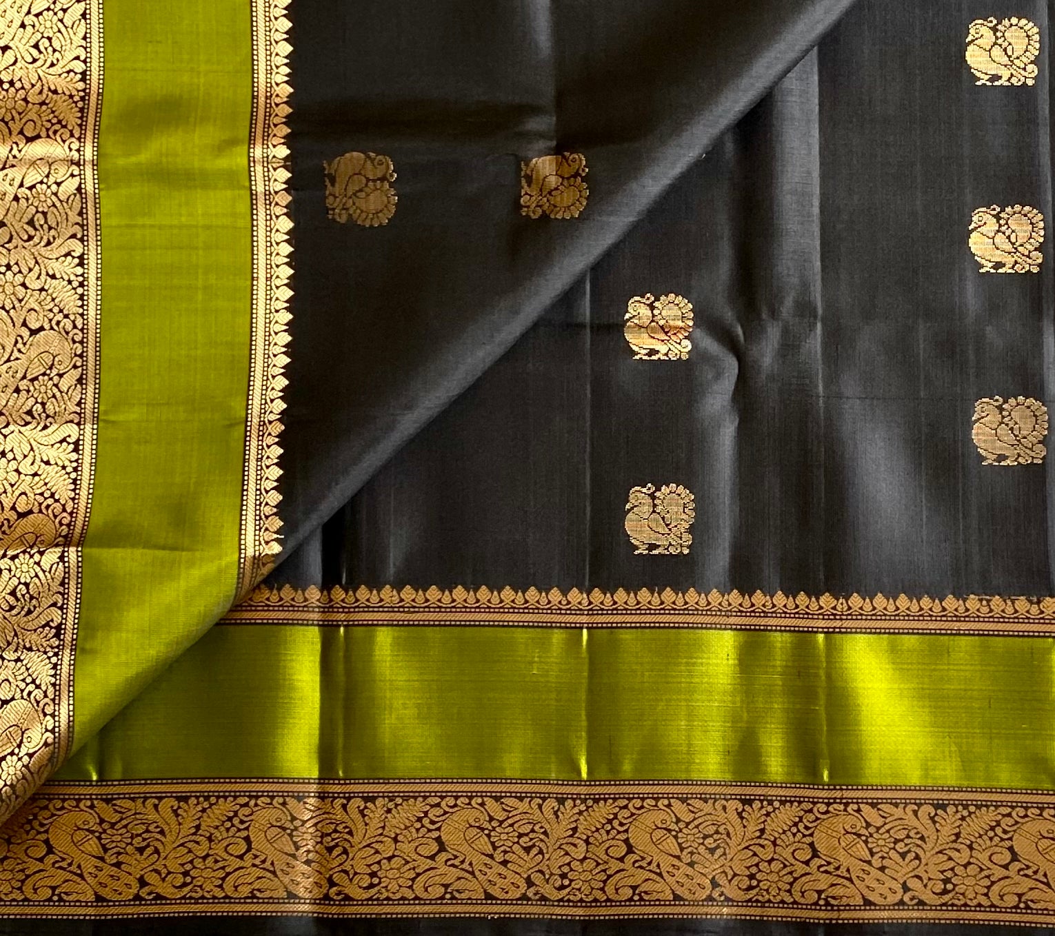 Navi Black with stunner Olive green Designer pure silk with peacock zari buttas