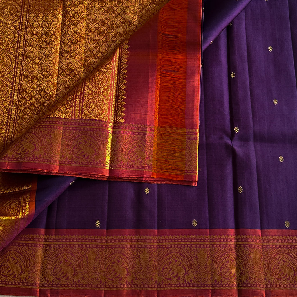 Elegant purple with dual shaded rust orange Kanjeevaram stunner