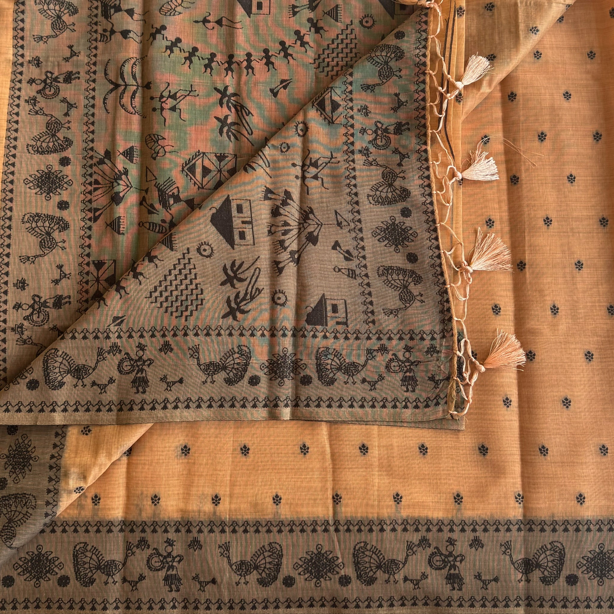 Elegant Muted Apricot Printed Tribal Pallu Saree With Tassel Border