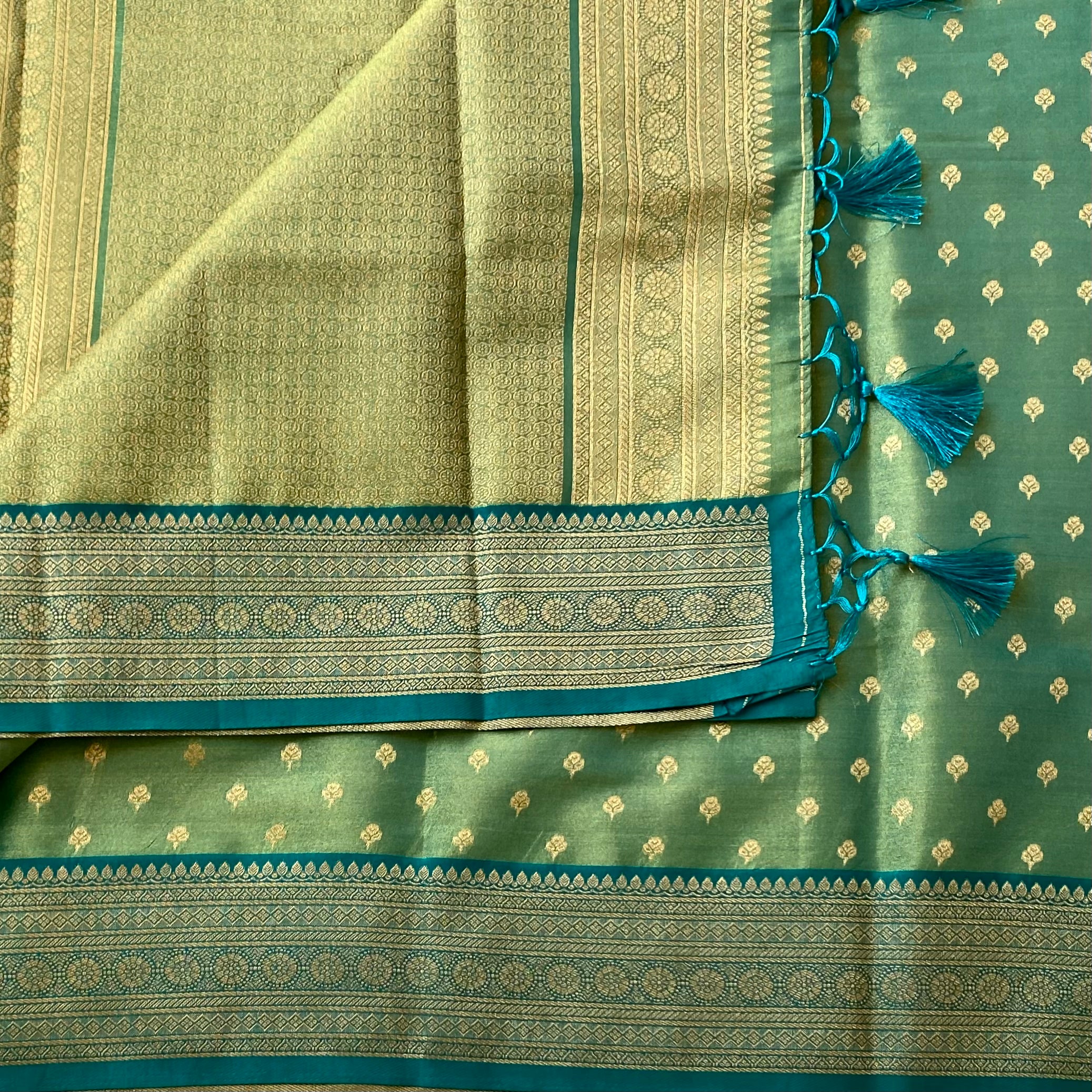 Magical dual shaded sea green soft tissue silk with rich brocade pallu & blouse