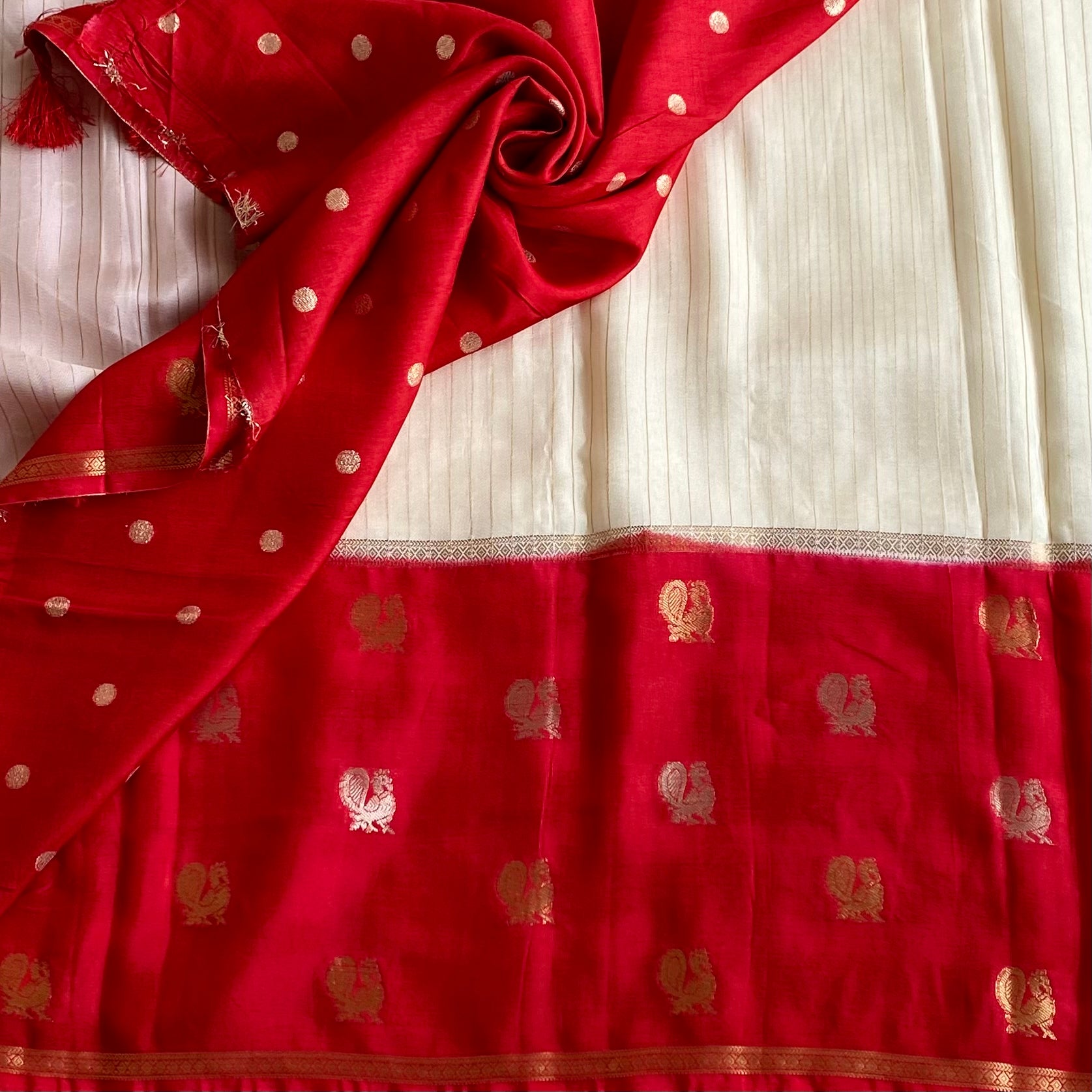Ivory Soft Crepe Silk With Crimson Red Pallu & Peacock Long Borders