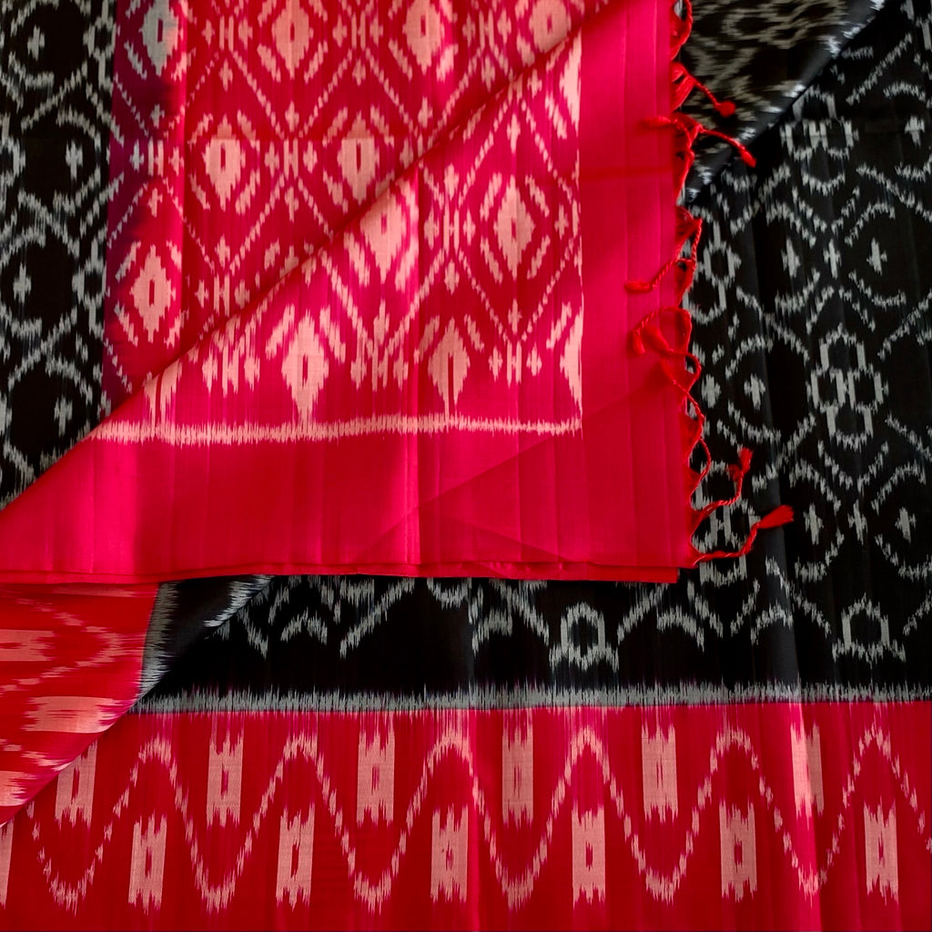 Stunner Jet Black Designer Ikkat Woven Pure silk with Tomato Pink Borders & Pallu