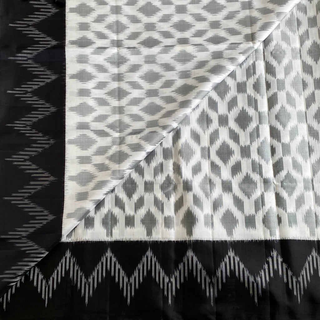 Pearl White And Black Designer Pure Silk Saree With Silver Gray Ikat Border
