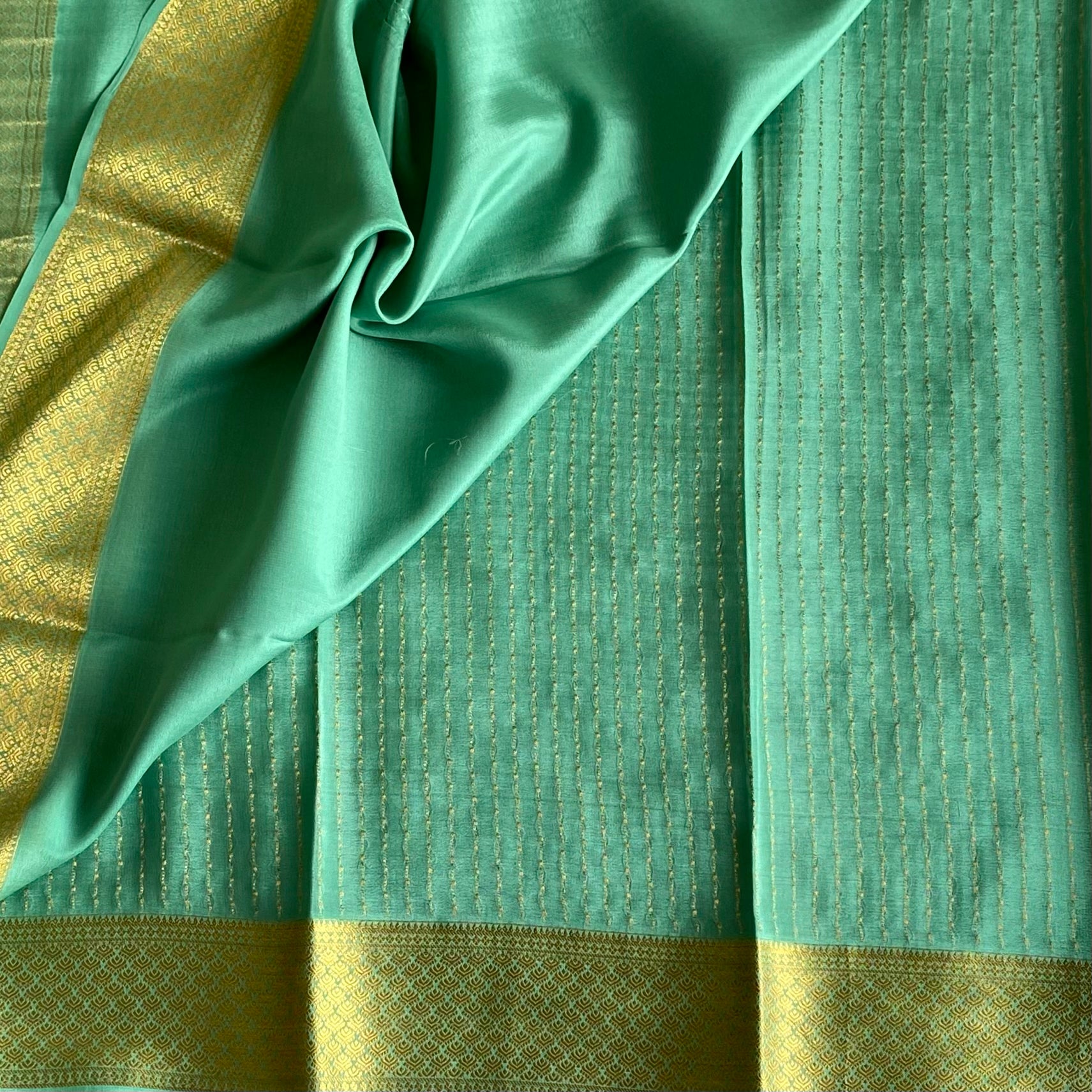 Dreamy Sea Blue Mysore Crepe Silk Saree With Metallic Gold Border
