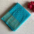 Turquoise Soft Crepe Silk Saree With Metallic Gold Brocade Border And Pallu