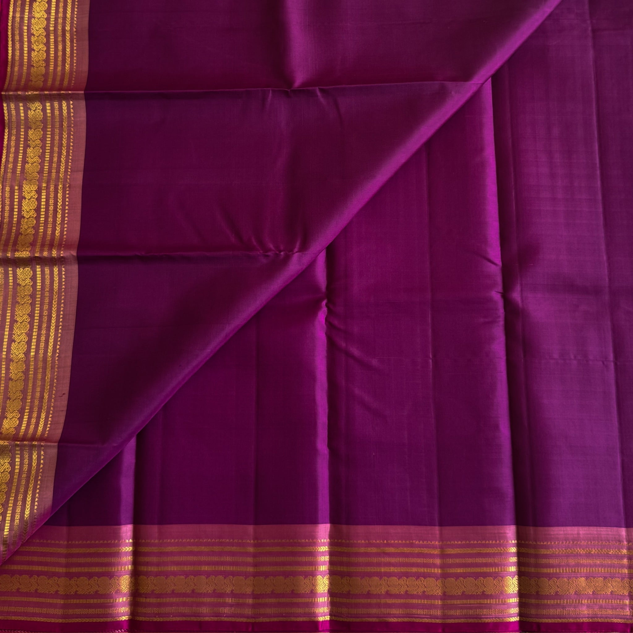 Traditional Magenta Gold Woven Saree With Floral Border And Tassels