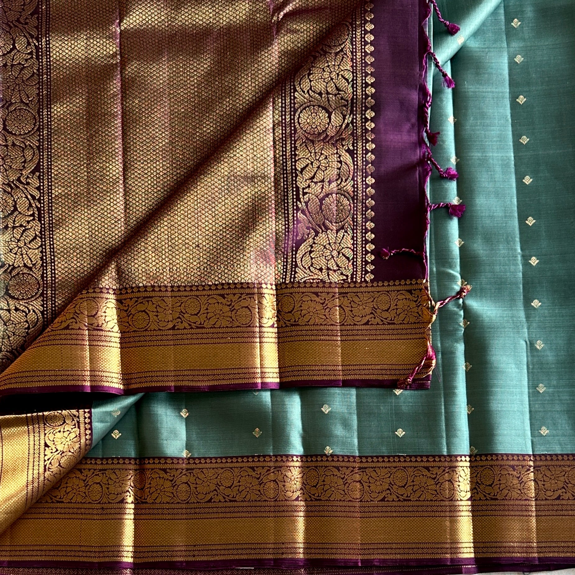 Teal Silk Saree with Plum Zari Border and Floral Pallu