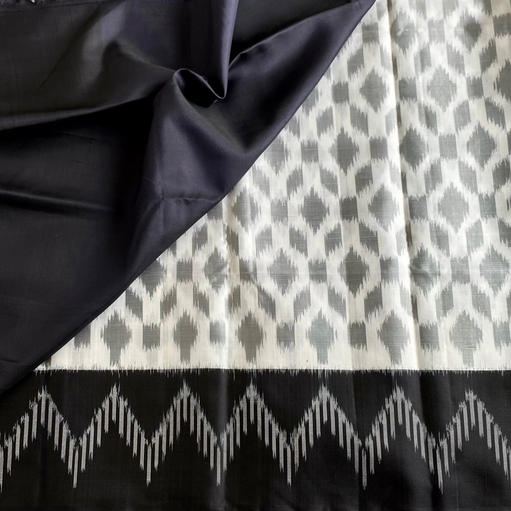 Pearl White And Black Designer Pure Silk Saree With Silver Gray Ikat Border