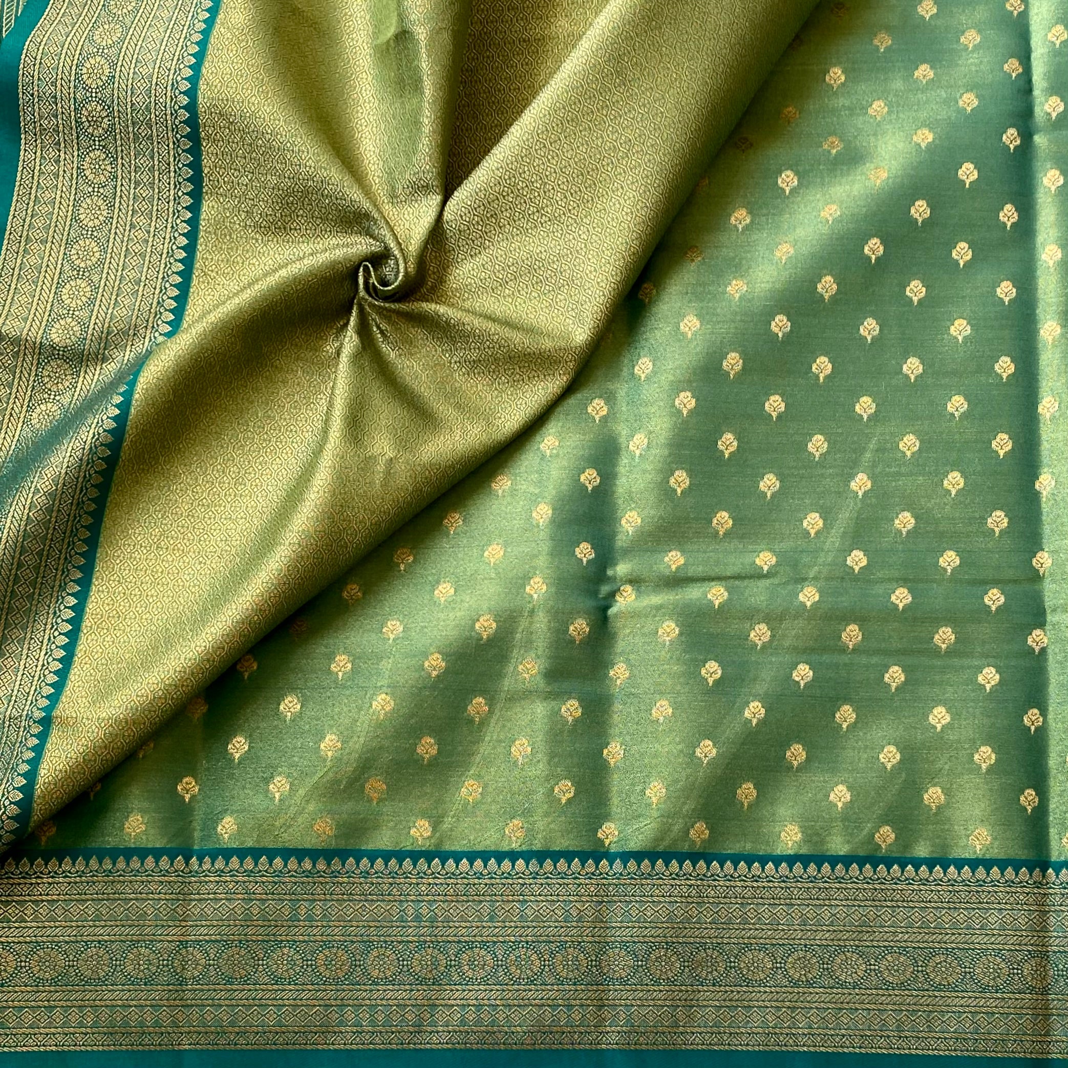 Magical dual shaded sea green soft tissue silk with rich brocade pallu & blouse