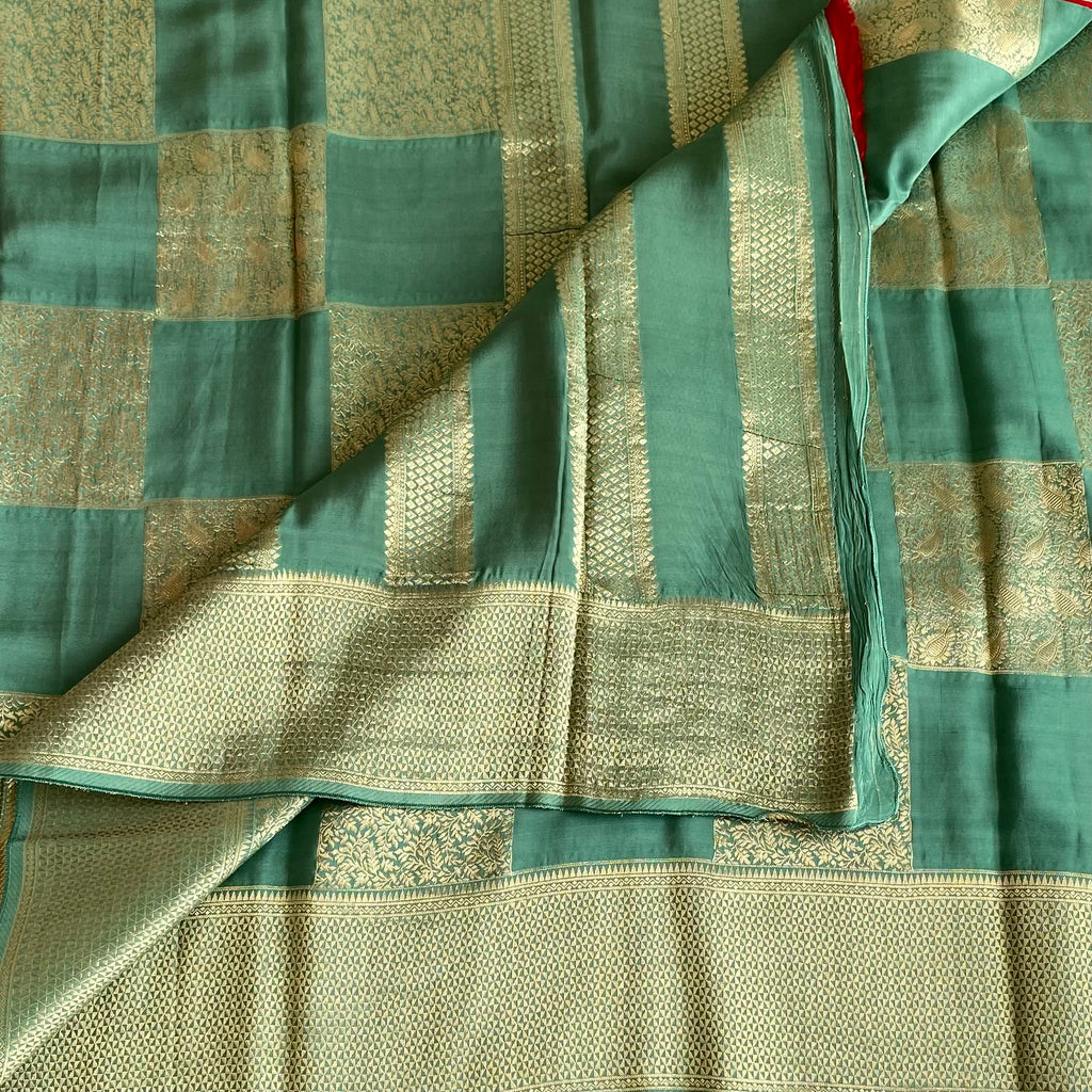 Teal Green Soft Premium Crepe Silk Saree With Gold Zari Checked Panels