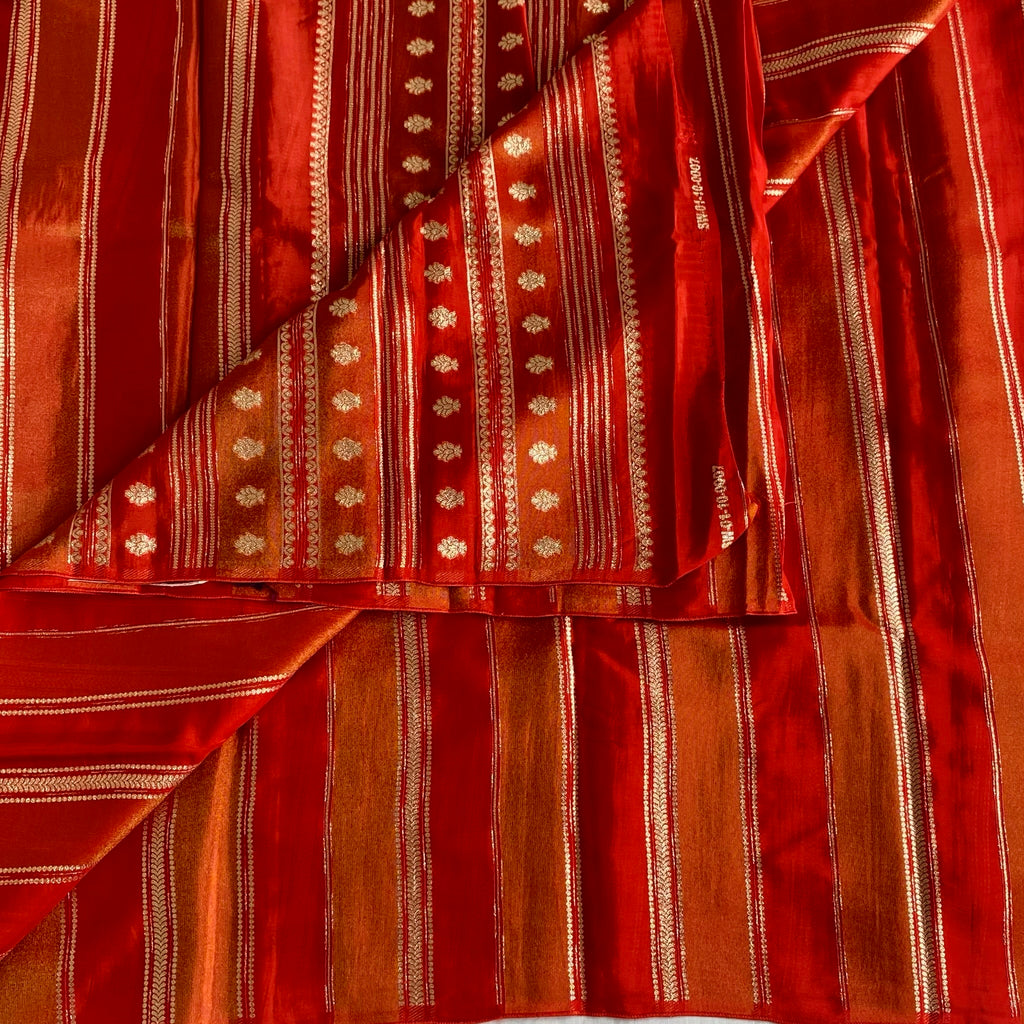 Vermilion Orangish Red Soft Tissue Crepe Saree With Metallic Gold Buttas And Stripes