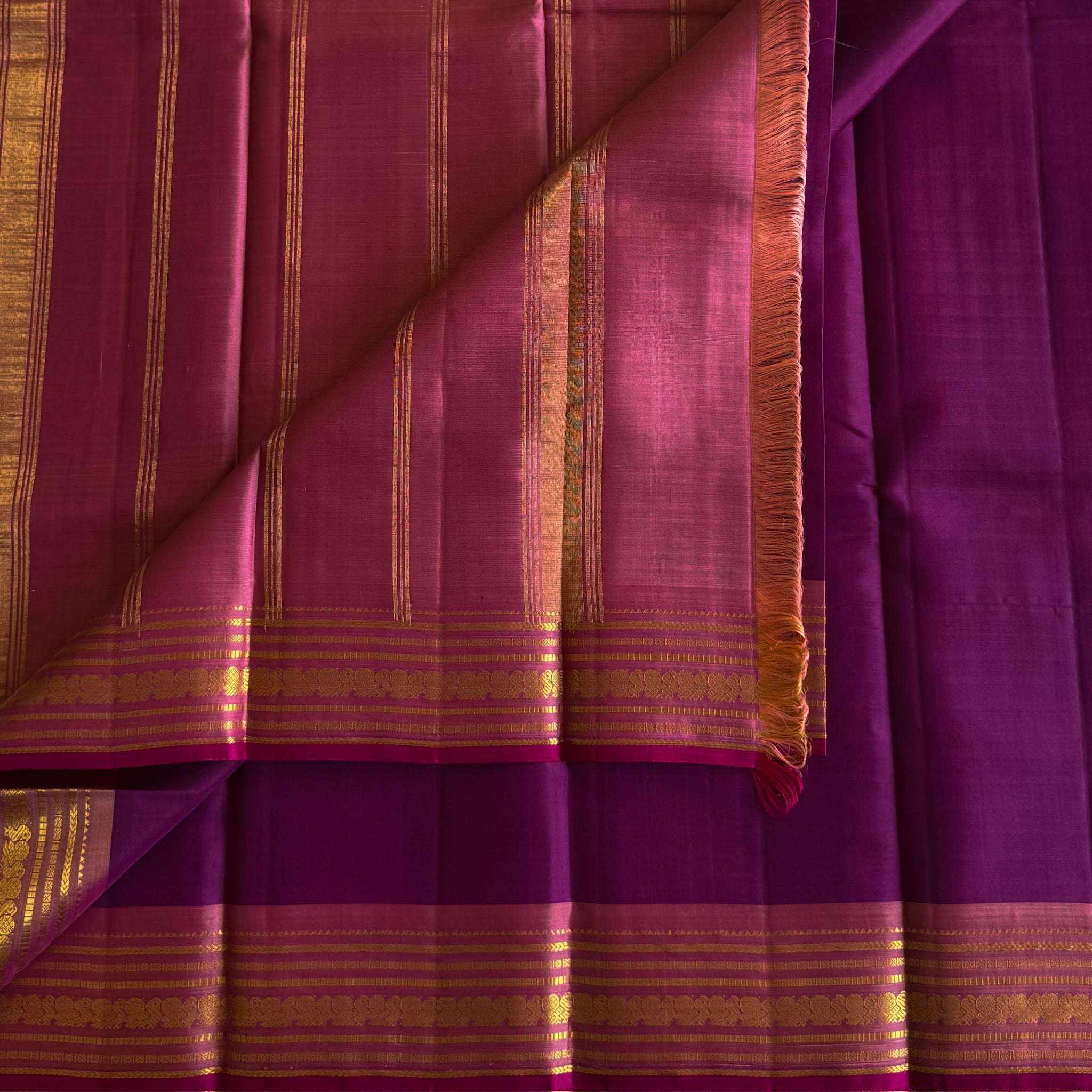 Traditional Magenta Gold Woven Saree With Floral Border And Tassels