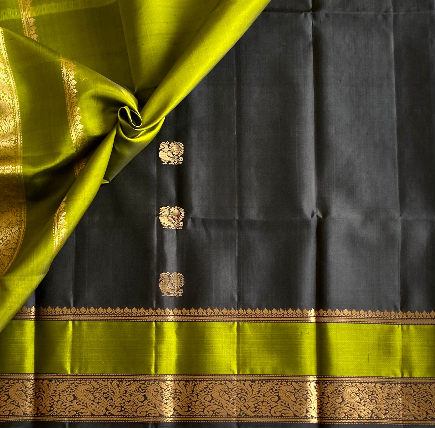 Navi Black with stunner Olive green Designer pure silk with peacock zari buttas