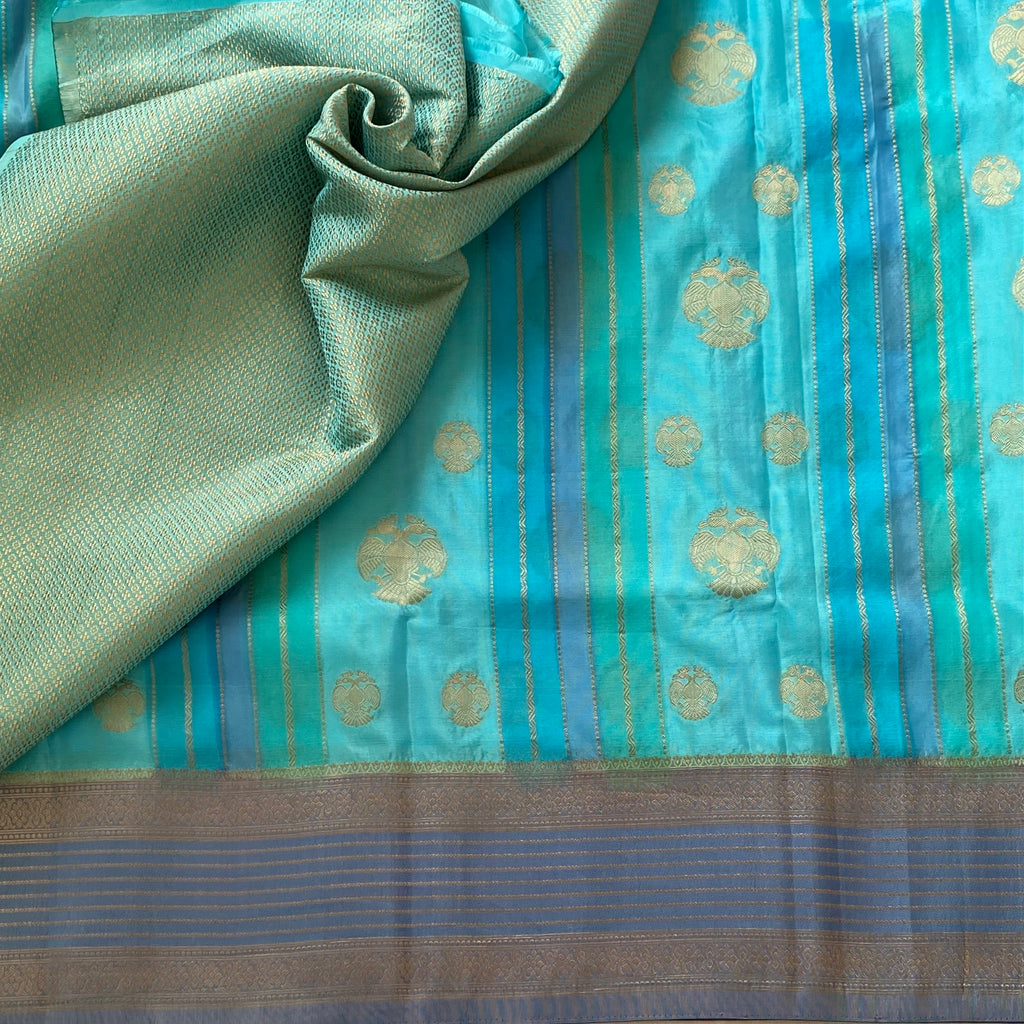 Turquoise With Slate Blue Soft Crepe Silk With Designer Gandaberunda Weave
