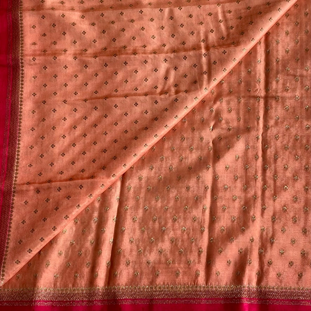 Blush Peach Banarasi Crepe Silk Saree With Rani Pink Pallu And Gold Zari