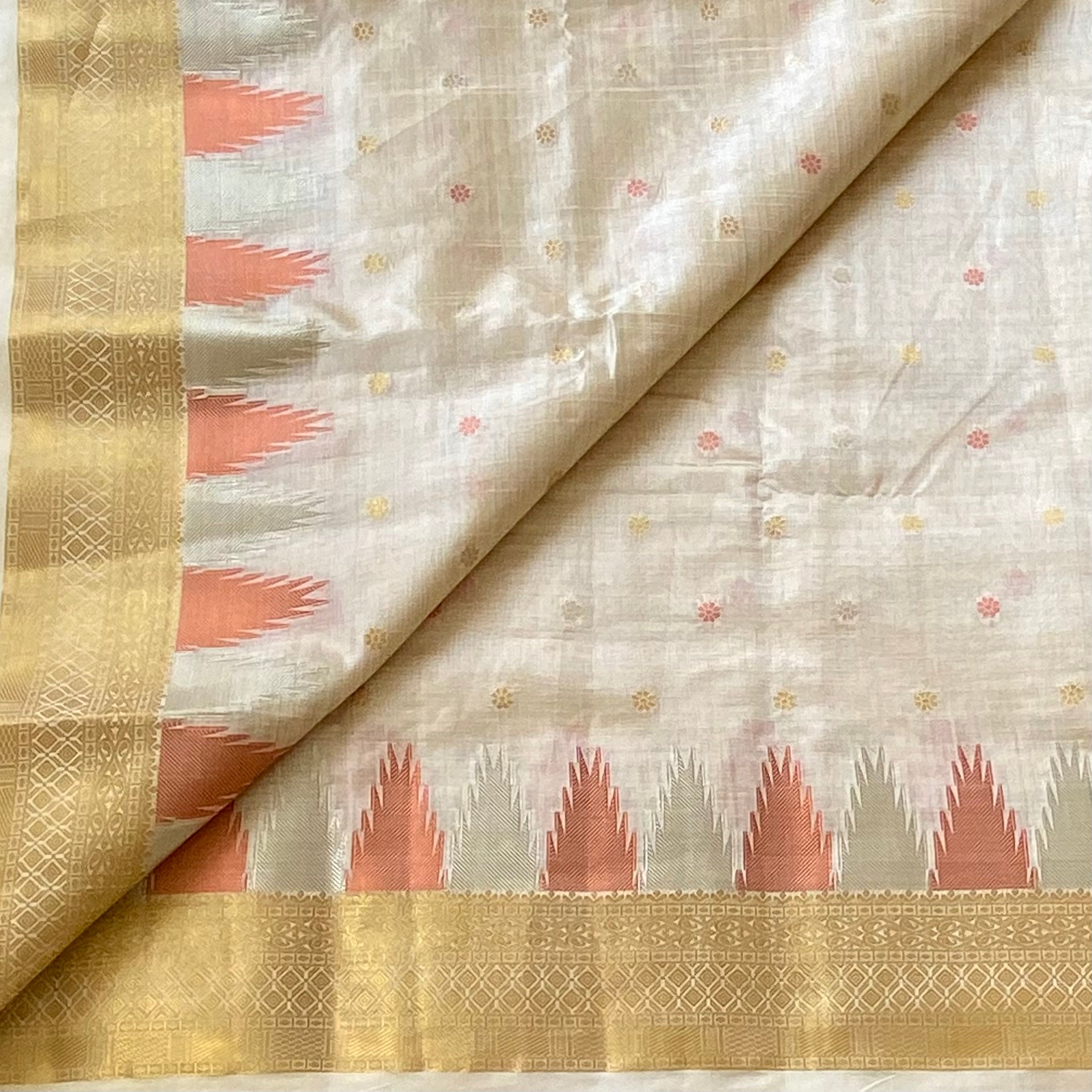 Ivory with gold zari soft tussar silk with temple borders