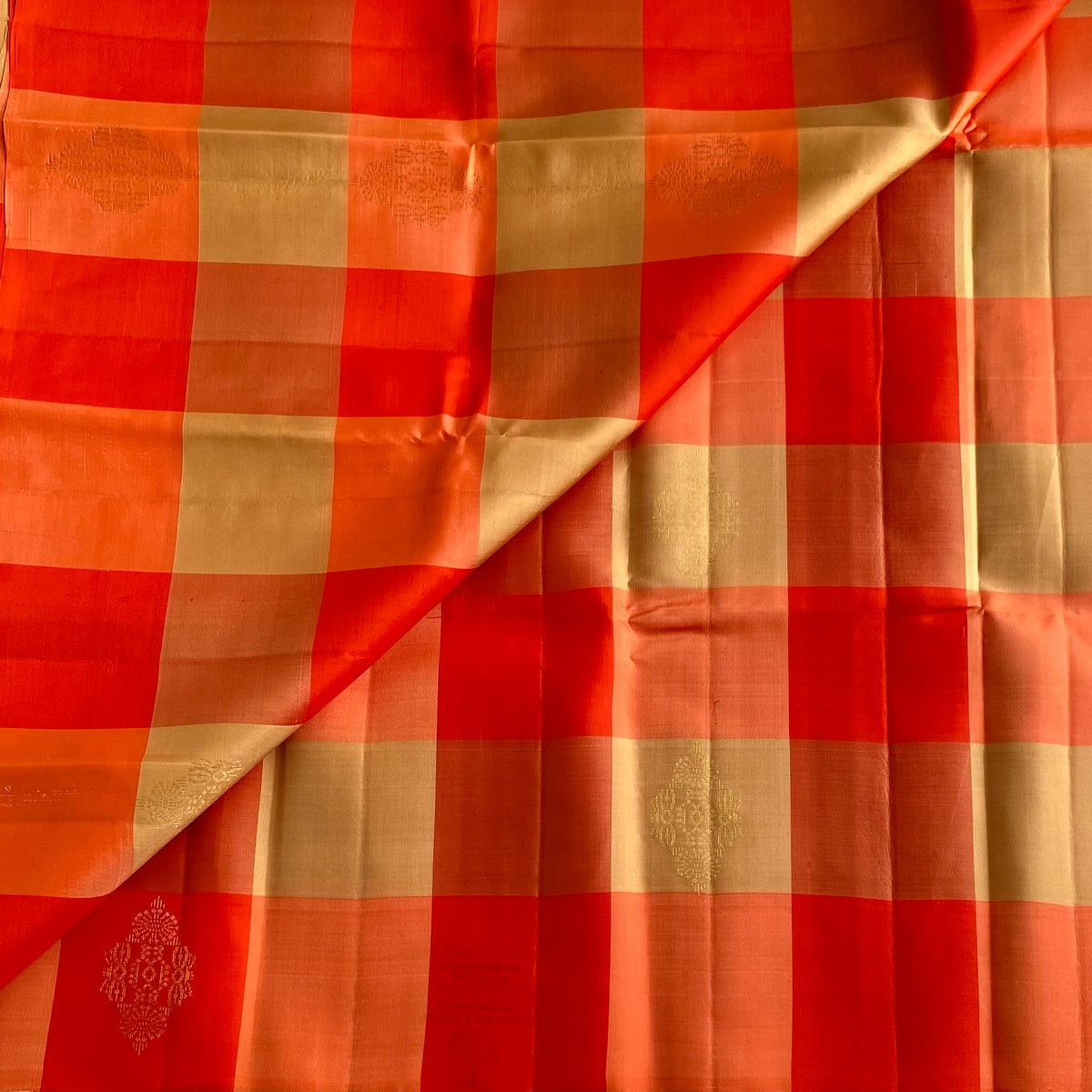 Vibrant Shades Of Orange Designer Pure Silk Saree With Golden Beige Checks