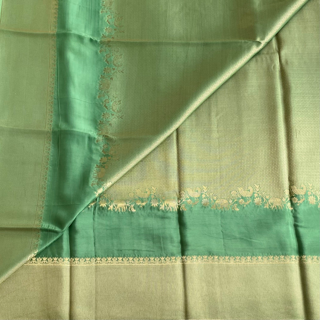 Teal Green Soft Crepe Silk Saree With Antique Gold Border Panels