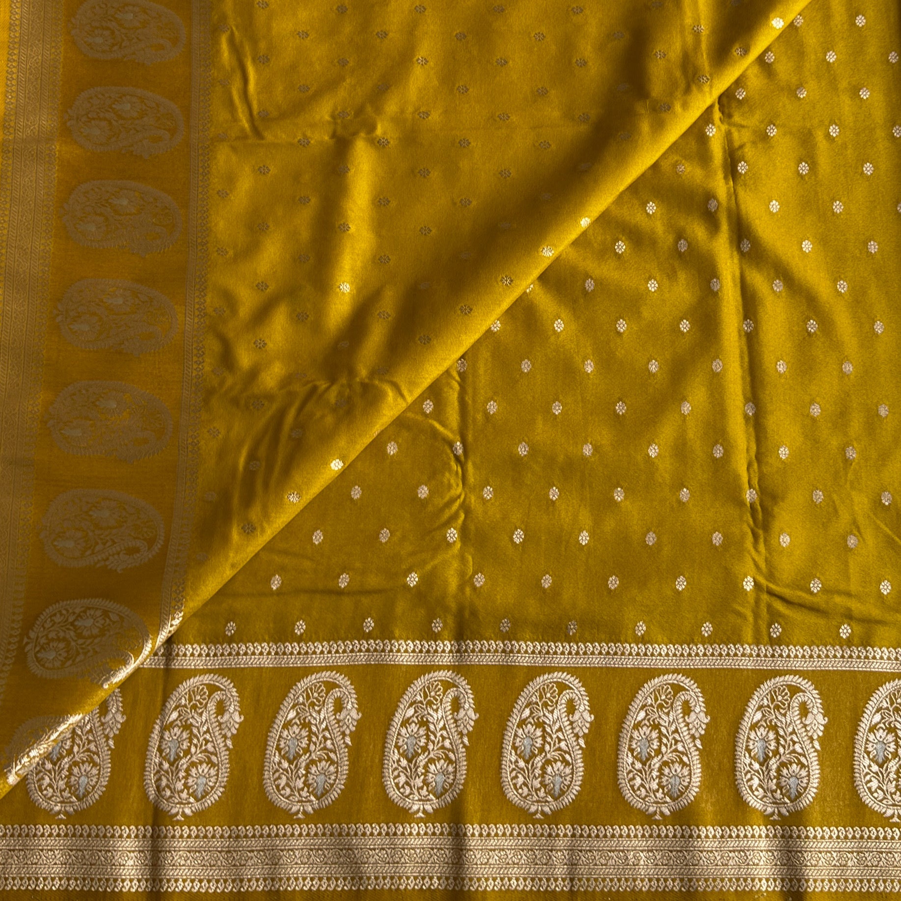 Elegant Mustard Gold Paisley Brocade Saree with Tassels and Borders