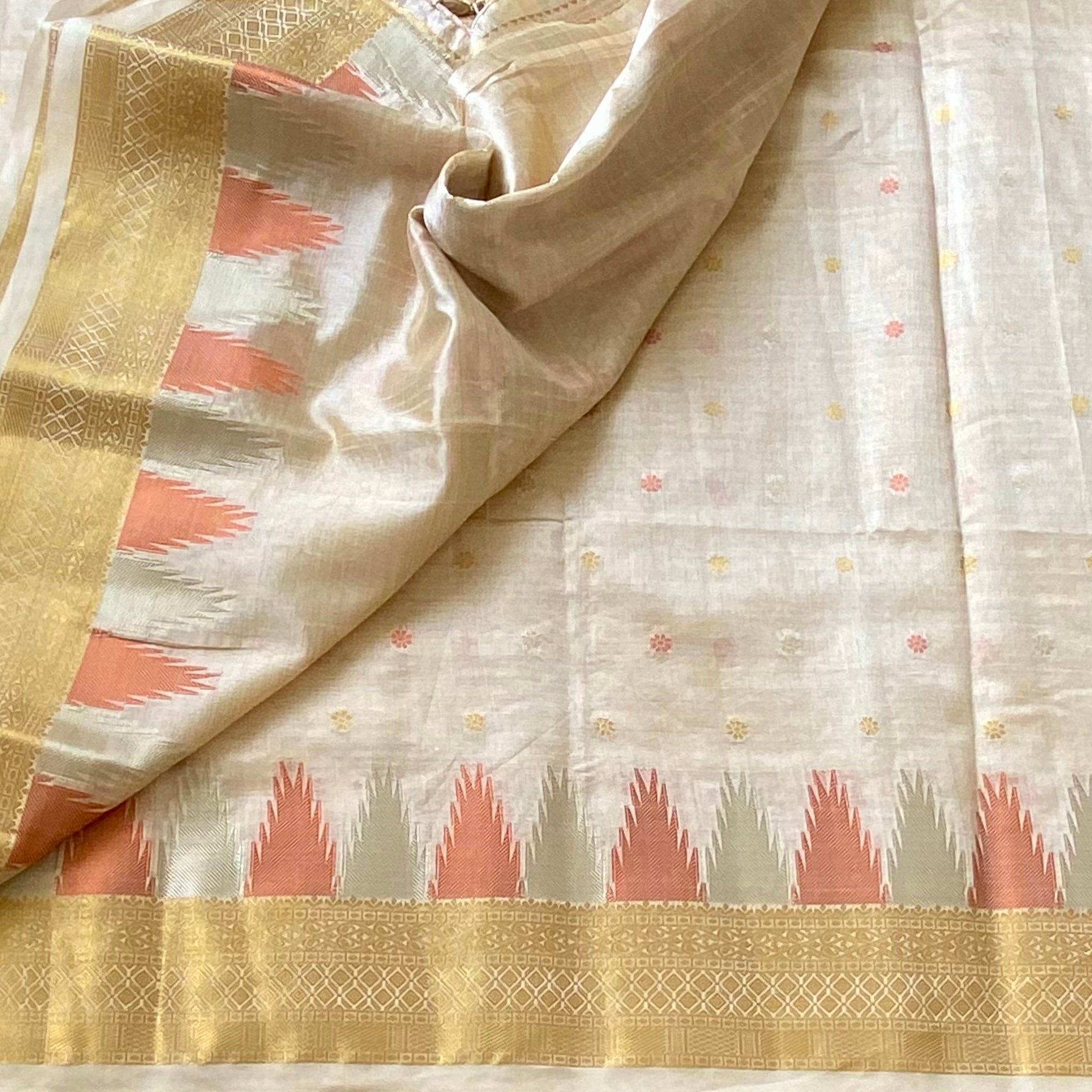 Ivory with gold zari soft tussar silk with temple borders