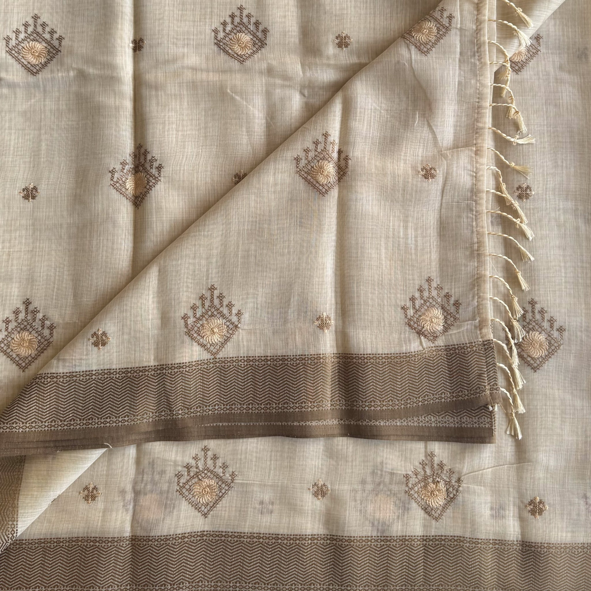 Ivory chestnut geometric handloom saree with woven zigzag border tassels