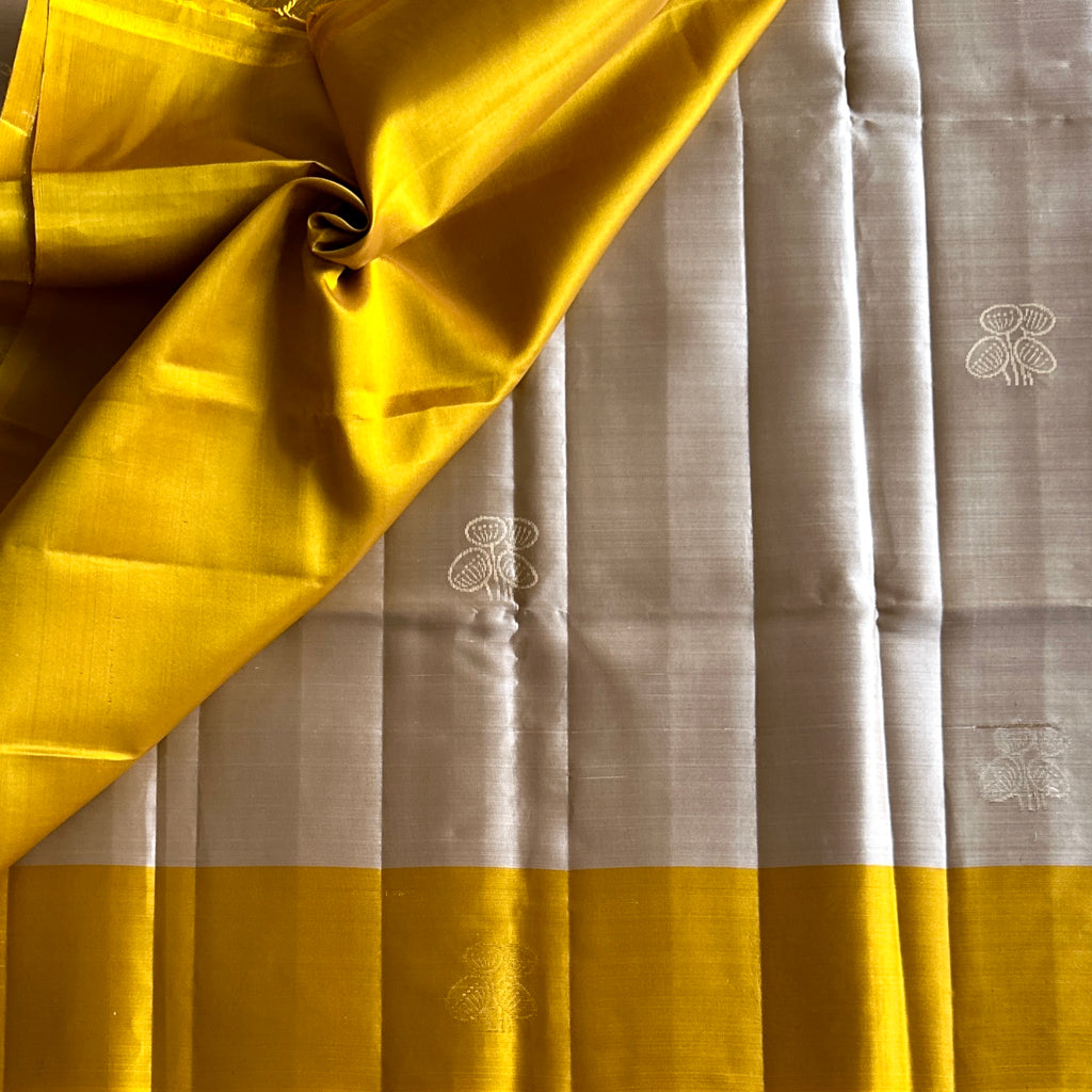 Mustard Yellow Silk Saree with Silver Zari Pallu Floral Motifs