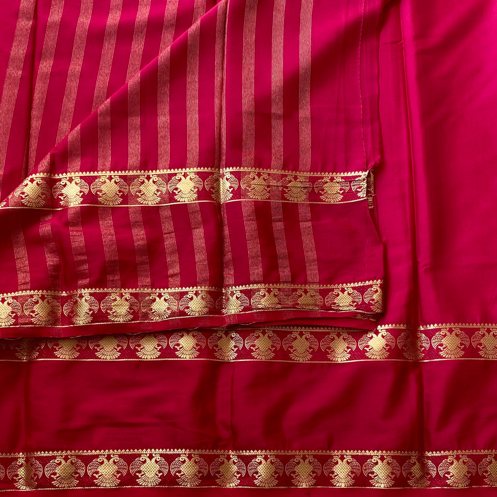 Magenta Silk Saree Gold Zari Stripes Floral Border Festive Wear