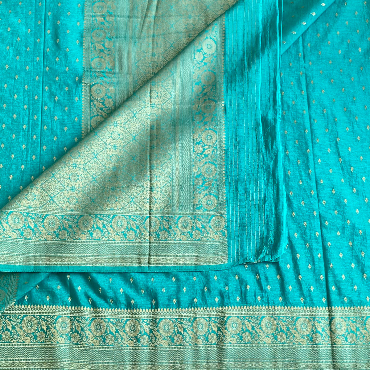 Turquoise Soft Crepe Silk Saree With Metallic Gold Brocade Border And Pallu